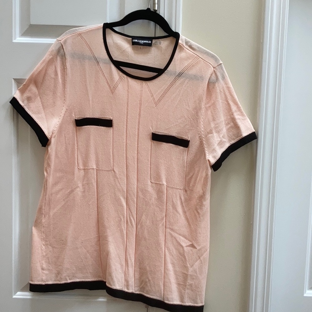 Light weight shell top Nylon and Rayon blend. Perfect with black pants or skirt